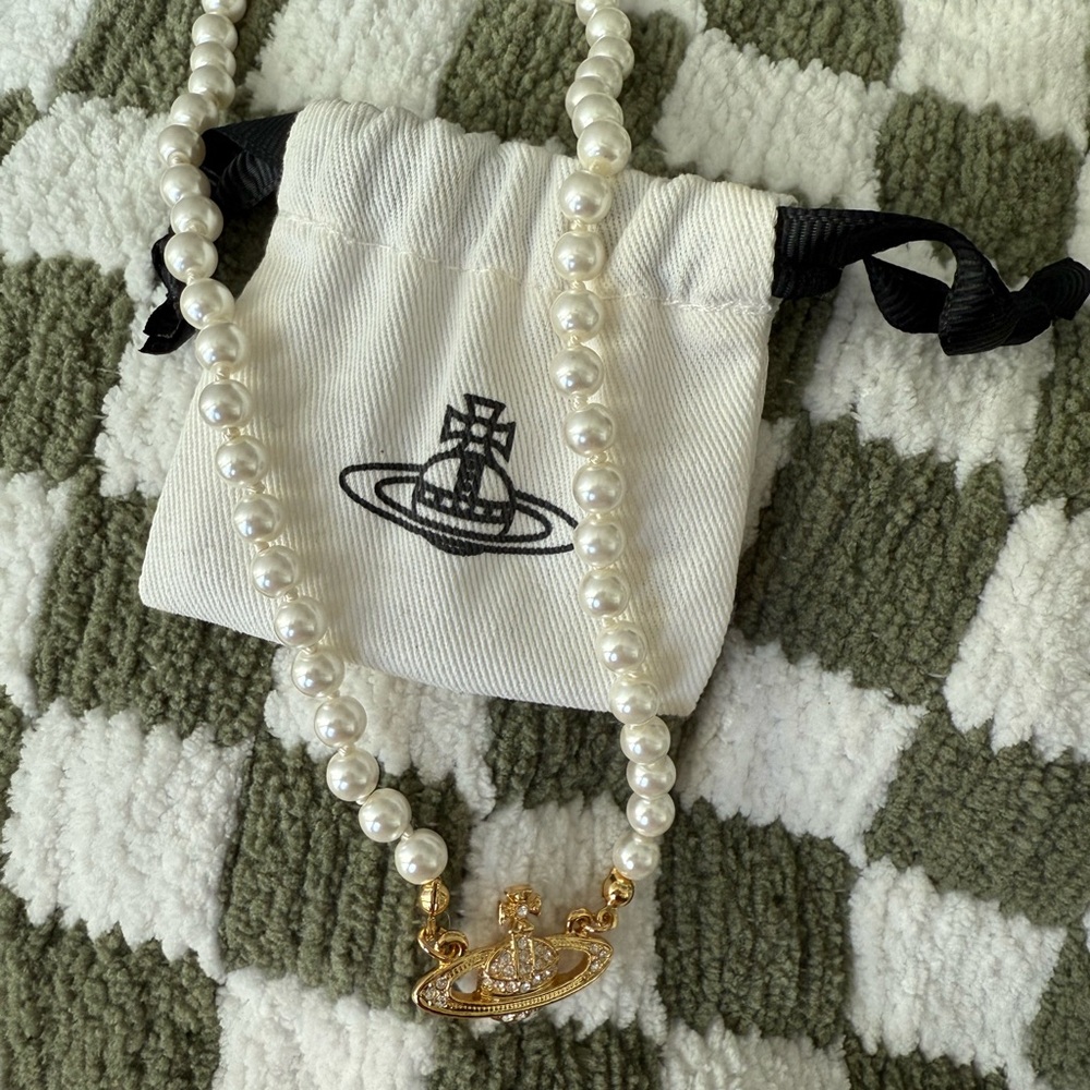 New Vivienne Westwood gold mini bas relief pendant necklace.